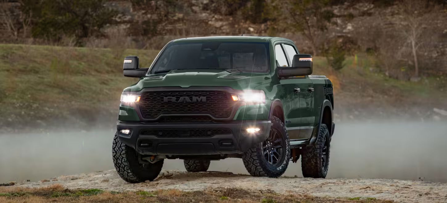 A green truck sitting parked.